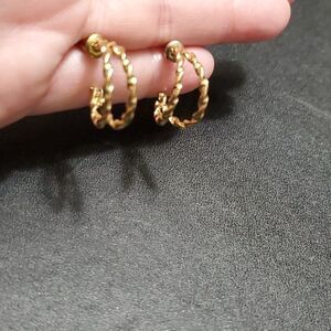 Gold tone twisted hoop earrings